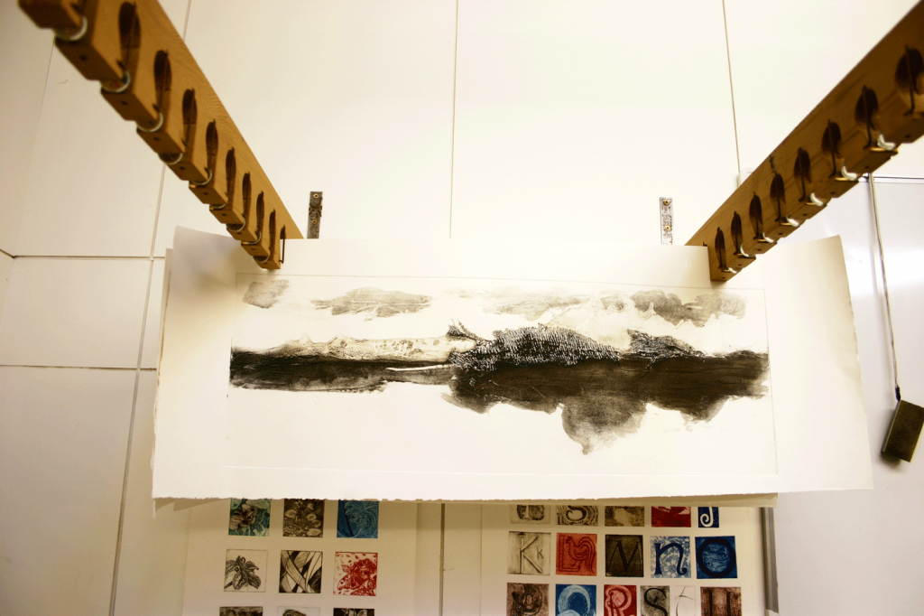 The print, hanging up to dry