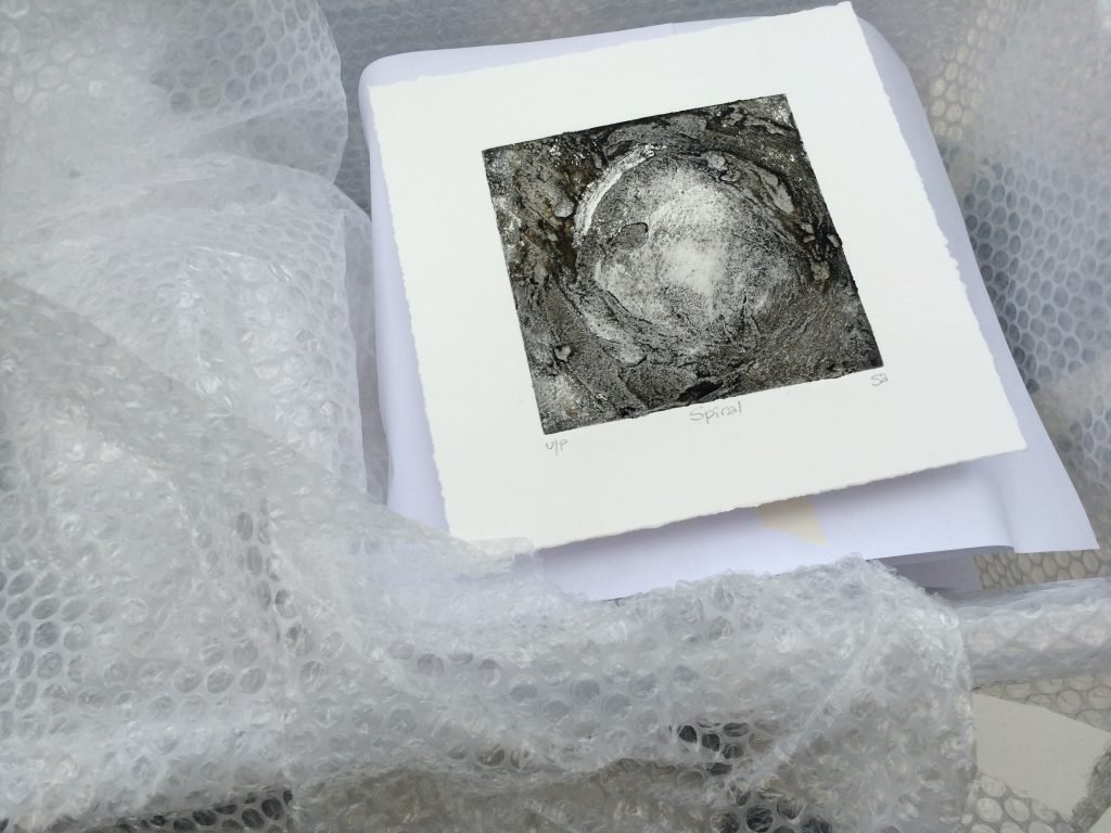 Framed and ready?! One of the small images being prepared for transportation to storage